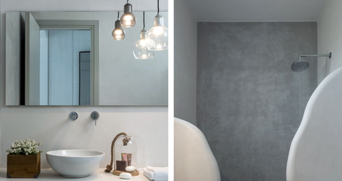 Split image showing a bathroom vanity with hanging industrial lights on the left, and a grey microcement walk-in shower on the right.